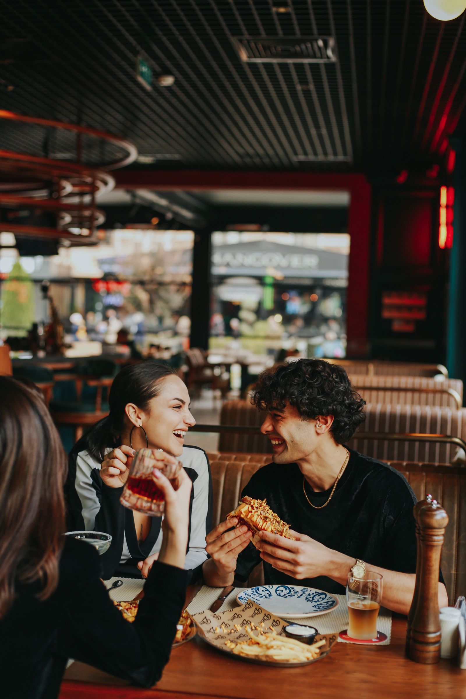 Friends enjoying a meal together at a restaurant